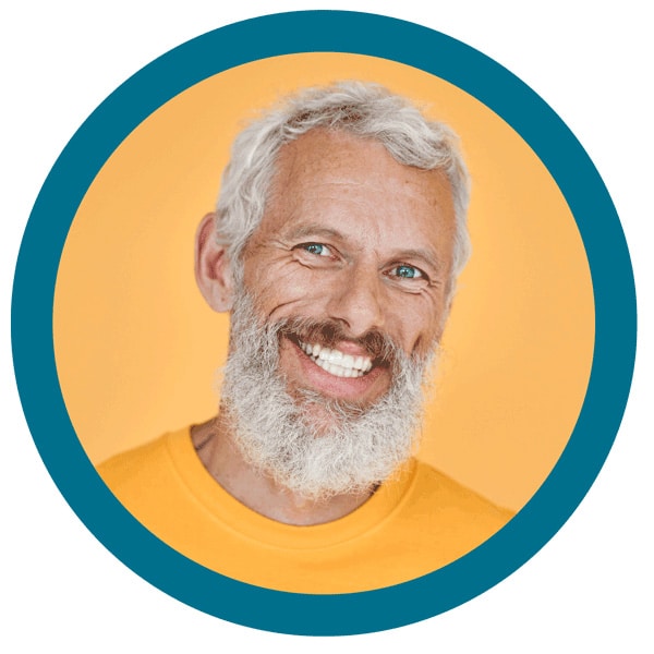 A Smiling Man With A White Beard On A Yellow Background.